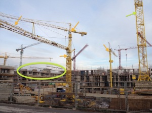 5 cranes on 1 construction site - looks like they want to get things done before winter.
